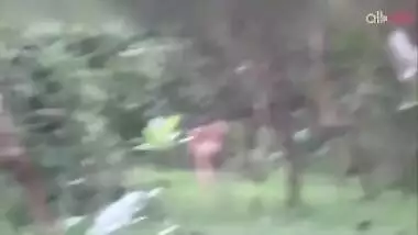 Two hot and sexy Desi aunty bathing in a outdoor under rain together