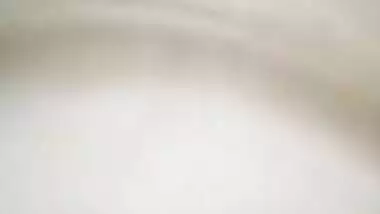 Indian holds a sex camera and touches her own XXX jugs and shaved slit