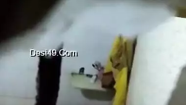 There is a hole in the bathroom and perv films the naked Indian